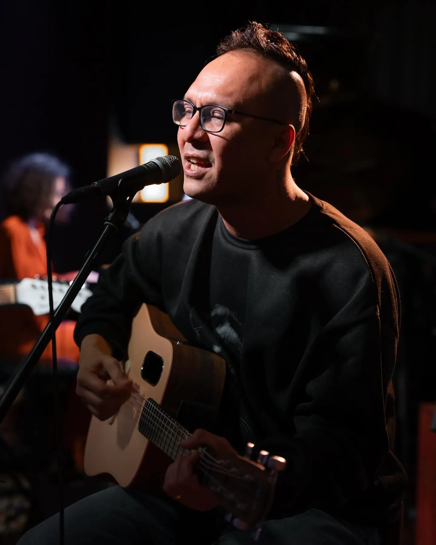 Han Htue Lwin, also known by his stage name Kyar Pauk, is a prominent Burmese singer-songwriter, guitarist, and music producer. Born in 1983 in Taungoo, Myanmar, he is the son of Ringo, a renowned mainstream singer from the 1990s.  He graduated in dental surgery from Yangon University in Myanmar. He chose to follow his passion for the arts instead of pursuing a medical career. He is a multifaceted Burmese artist renowned for his contributions to music, literature, and visual arts. 

He has made significant contributions to Myanmar’s punk and alternative music scenes, most notably as the founder and lead vocalist of the punk rock band Big Bag which he founded in the summer of 2001.  The band’s high-energy performances and rebellious spirit quickly connected with young audiences, creating a loyal fan base. He is also a multi-instrumentalist, proficient in guitar, vocals, handpan, and drums.  His contributions continue to inspire and influence a new generation of artists in the country.  It is evident that the nation’s political instability has influenced the themes and expressions in his music. Like many artists, Kyar Pauk uses his platform to address societal issues, and the political climate has undoubtedly shaped the powerful messages in his songs.

In addition to his music and writing, Kyar Pauk has made a name for himself as a talented visual artist, captivating audiences with his thought-provoking paintings and exhibitions. On March 9, 2018, he held his first solo art show, “Outelligence,“ in Yangon, offering a glimpse of his artistic talents beyond music. His creative work extends to comics and his paintings have been showcased in both group and solo exhibitions, including “Liberated Zone“ at the Suvannabhumi Art Gallery in Chiang Mai, Thailand (2022), and “The Travel of Hope“ at Heartspace Gallery in Chiang Mai (2023).

Additionally, Kyar Pauk served as a coach on The Voice Myanmar for its first three seasons, from 2018 to 2020, where he mentored aspiring singers, sharing his rich musical knowledge and experience.

After the 2021 Myanmar coup d’état, Kyar Pauk became an active participant in the anti-coup movement, using social media to voice his opposition. On April 3, 2021, the State Administration Council issued an arrest warrant for him under section 505(a) of the penal code, due to his outspoken criticism of the coup and his support for the Civil Disobedience Movement (CDM). His vocal stance against the junta ultimately led to his exile.

On October 18, 2021, he auctioned a custom-painted ukulele featuring his distinctive doodle art. The auction raised $27,500, setting a world record for the most expensive ukulele ever sold. All proceeds were donated to support the National Unity Government's efforts against the military junta. 
[Youtube Link: https://youtu.be/nwVjrO2uAgk]

Escaping Myanmar with his two daughters, he spent two years in hiding in Thailand. In 2023, Kyar Pauk relocated to France and became a member of the Agency of Artists in Exile, an organization supporting artists who have fled their home countries. He has organized numerous fundraising activities to support the National Unity Government (NUG).  Since his arrival, he has been actively involved in the French art scene, participating in exhibitions and performances. 

He is also an accomplished author, having published several books such as Knott Funni, The Strange Old Man, Kyaung Sar (2019), and The Odyssey (2024), the latter of which was translated into both French and English. In “The Odyssey“, he reflects on themes of displacement, identity, and belonging. Having fled a politically unstable Myanmar, the book highlights the sense of loss and confusion that many exiles experience, but it also delves into the process of adaptation and reinvention.

To reconnect and engage with his fans, Kyar Pauk released “Live Session in Paris,“ an album showcasing live performances of his songs, recorded during a special session in Paris.The live session was streamed online on December 21, 2024, giving ticket holders an exclusive opportunity to be part of the experience., and is now available for free viewing on his YouTube channel.