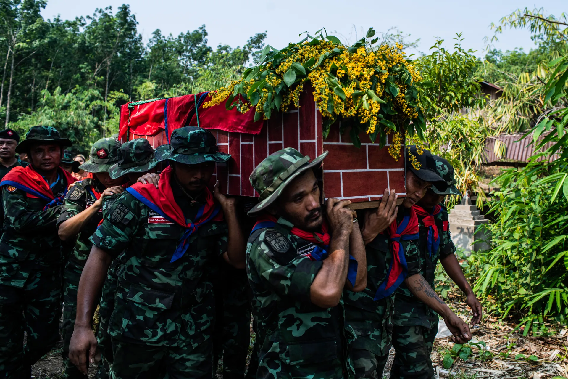This photo taken on April 13, 2024 shows people defense force member are carrying the deadbody of their member to celebrate the funeral event. Photo - Mar Naw