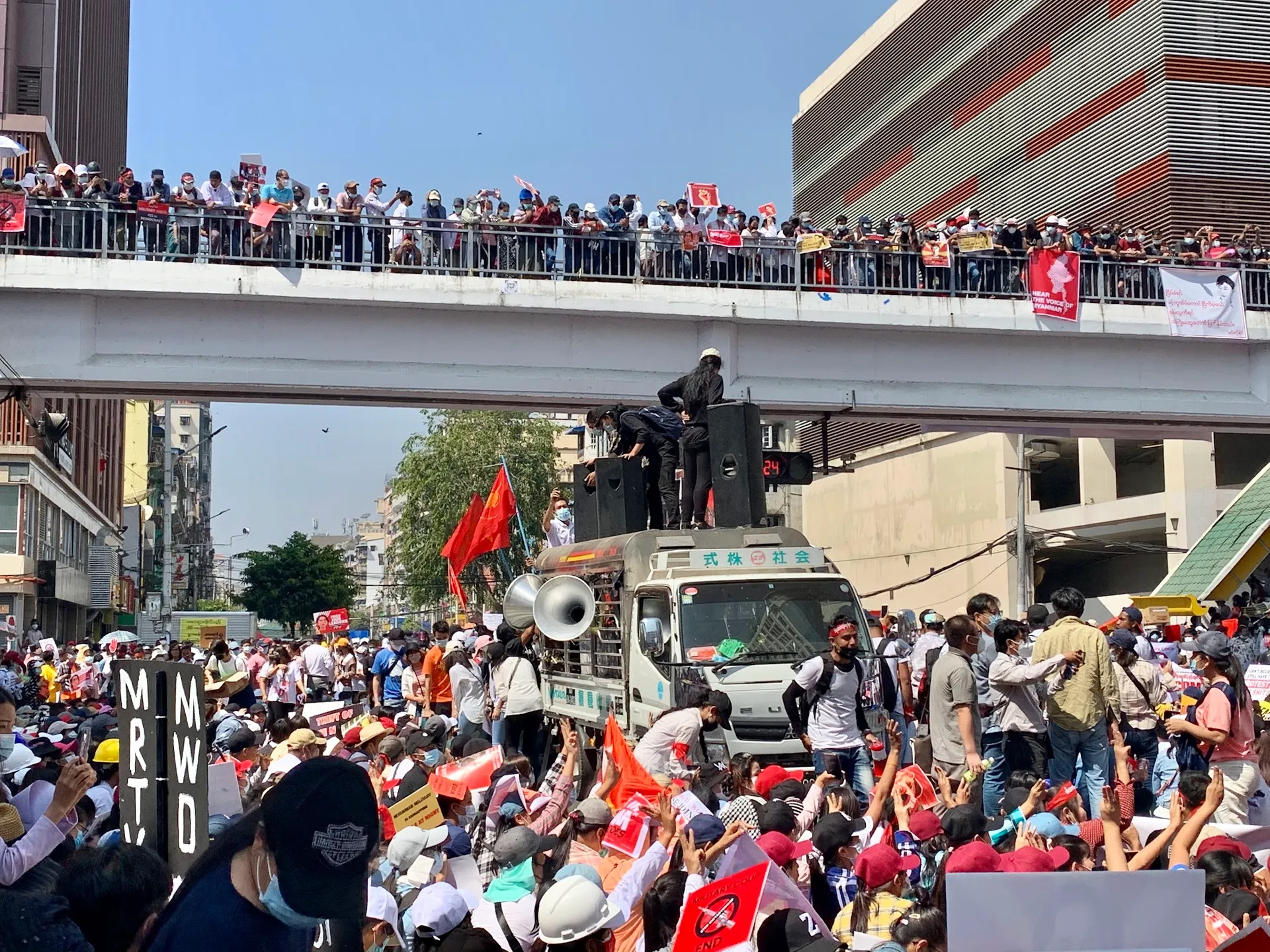 On February 17, 2021, at 11:28 AM, a protest group was seen preparing on top of a vehicle under the pedestrian bridge on Bogyoke Pagoda Road in Sule before starting a public speech event.